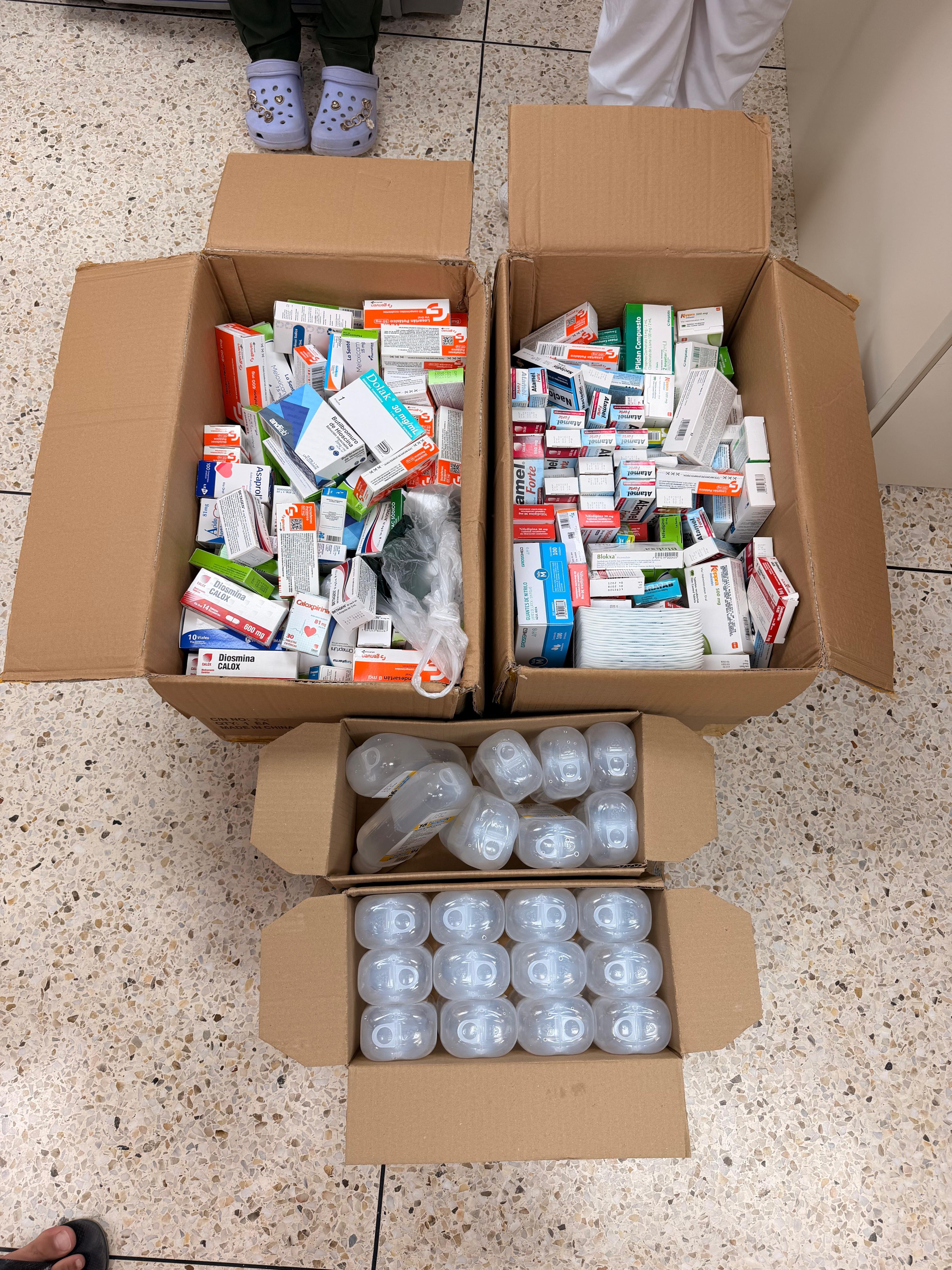 Three boxes of donated medicines and supplies, ready to send.